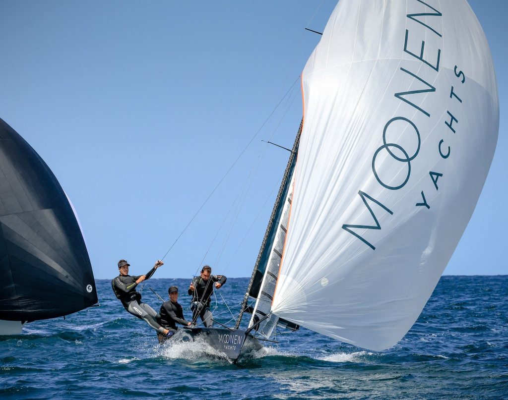 The Moonen Yachts Racing crew preparing to drop the kite during the 2022-23 16ft Skiff Australian Championships.