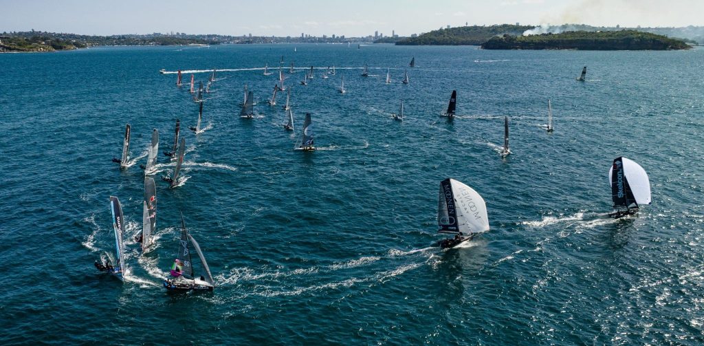 Moonen Yachts Racing around the top mark in Sydney Harbour during the 2022-23 16ft Skiff Australian Championships.